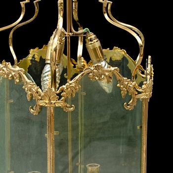 A brass ceiling light "Jubileumslyktan" by K.A. Jonsson, signed and dated 2002.