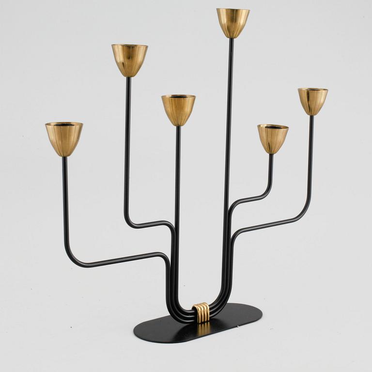 A candelabrum and one camdelstick by Gunnar Ander for Ystad Metall, 20th century.