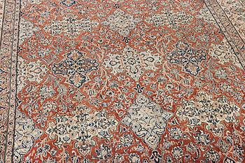 A semi-antique/old Nain carpet, part silk, c. 343 x 230 cm.
