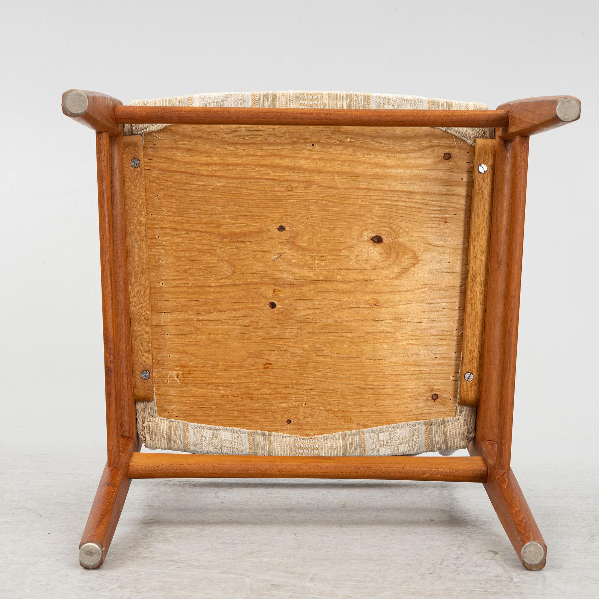 A dining table with six chairs, mid 20th century.