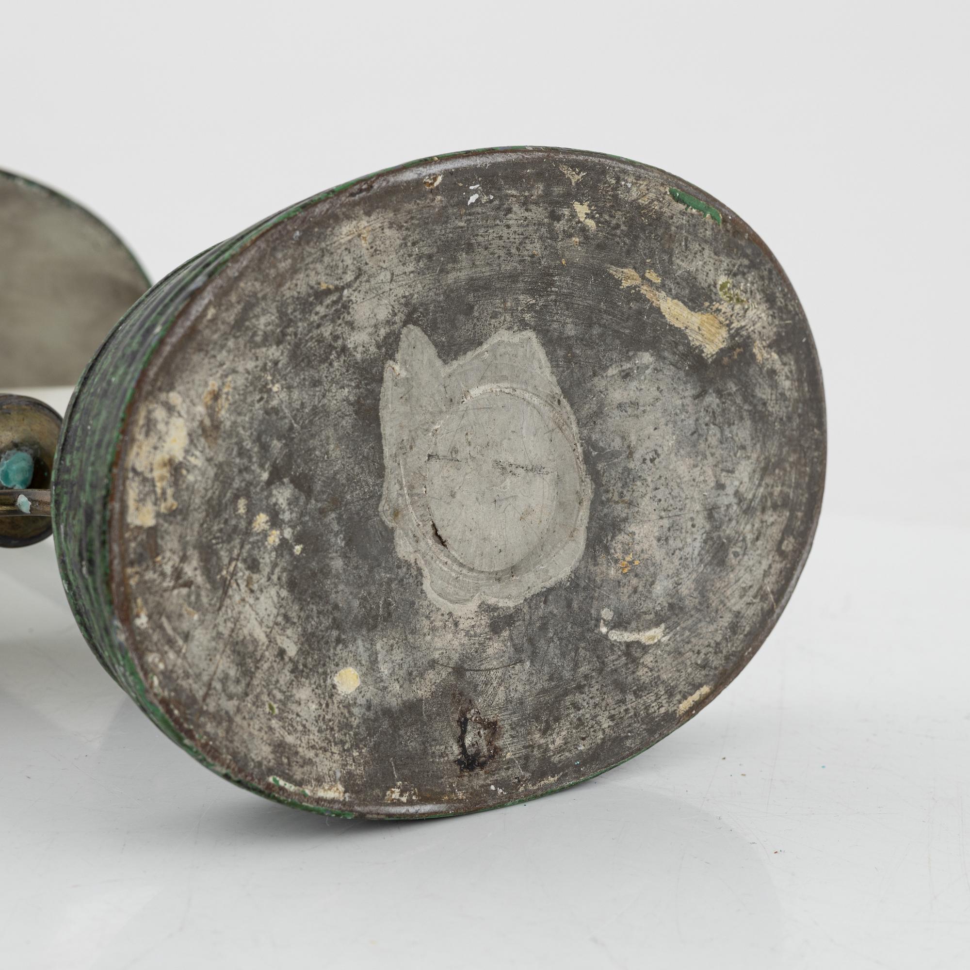 An empire style candlestick, circa 1900.