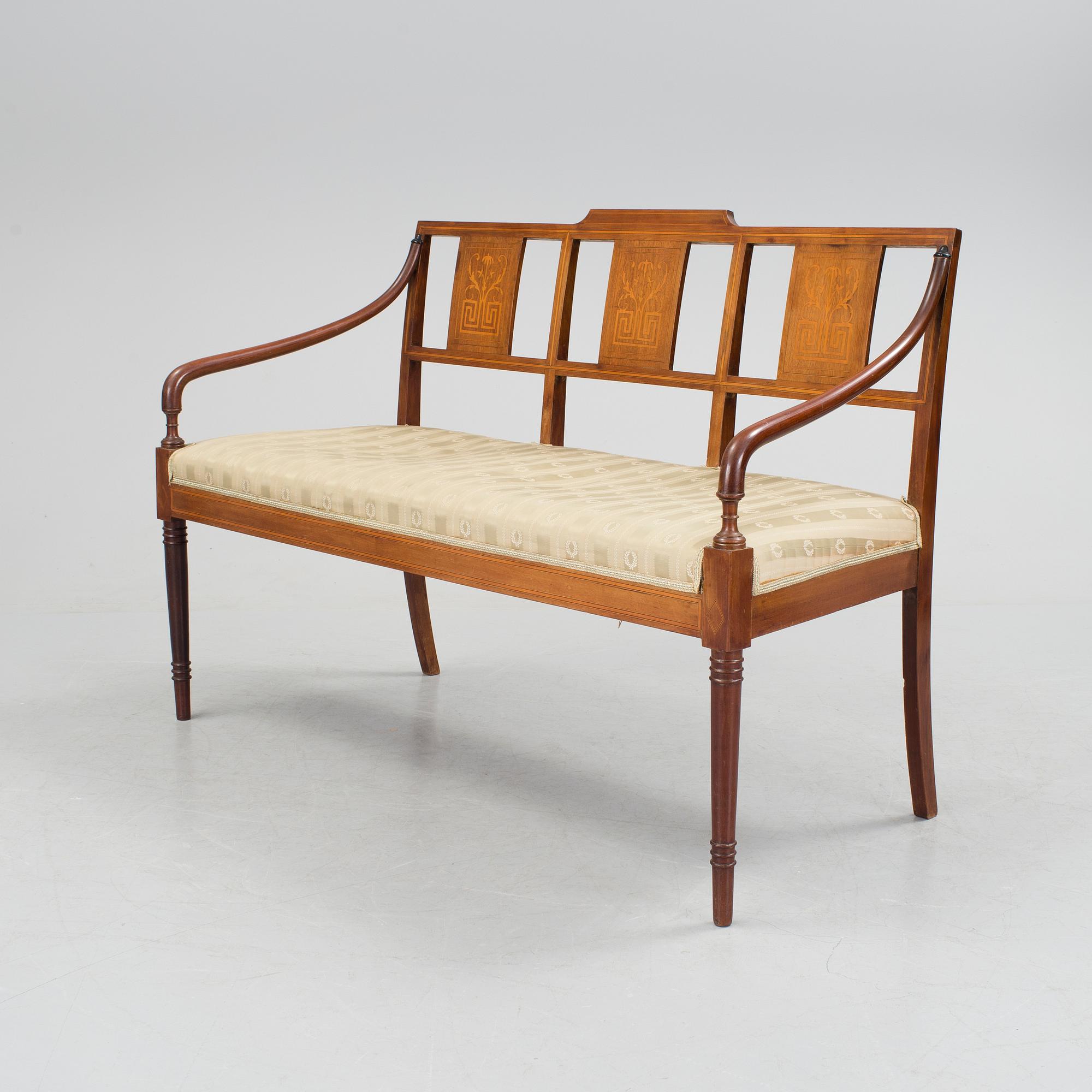 A 1920/30s Swedish Grace sofa, a pair of chairs, a pair of armchairs and a table veneered with mahogany.