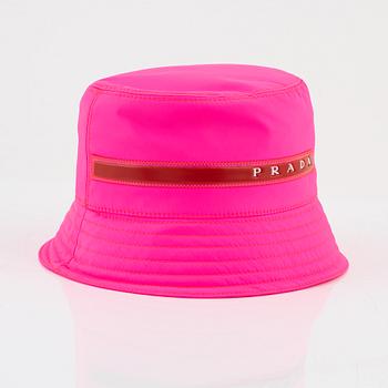 Prada, a neon pink bucket hat.