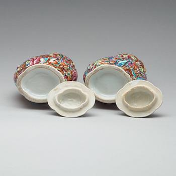 A pair of famille rose vases with covers, Qing dynasty, Qianlong (1736-95).