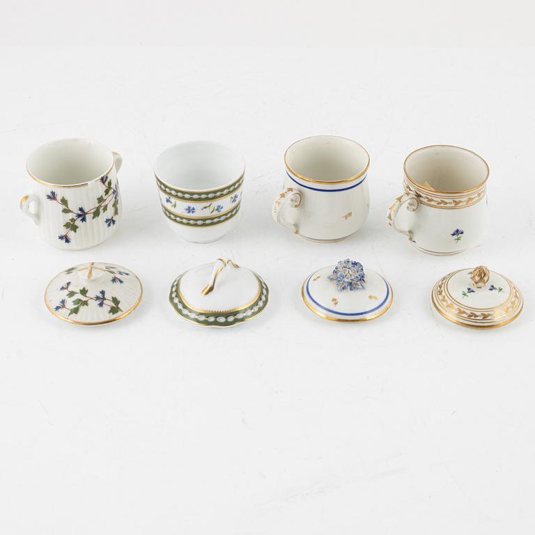 A set of nine Austrian and French custard cups with covers, 19th/20th Century.