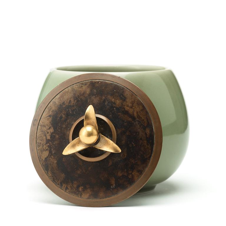 A Royal Copenhagen porcelain bowl with a patinated bronze cover, probably by Knud Andersen, Denmark 1957.