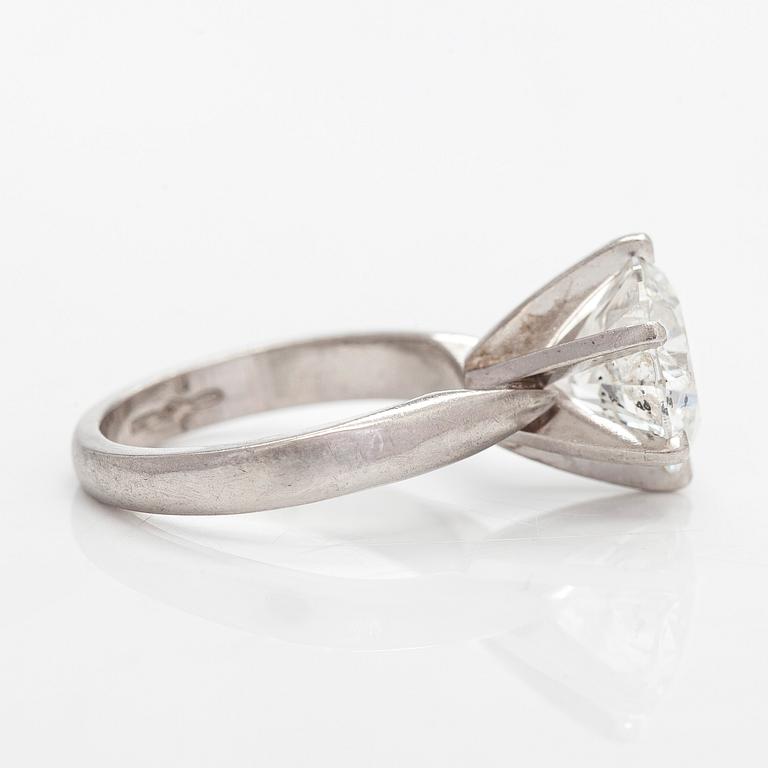 A platinum ring, with a brilliant-cut diamond approximately 3.10 ct. Domino Jewellery, Birmingham, England.