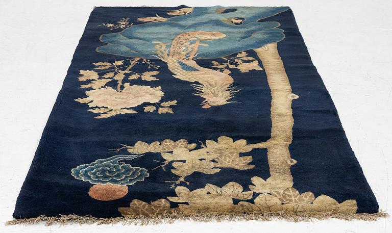 A Chinese ’phoenix rug’, 20th century, c. 181 x 93 cm.