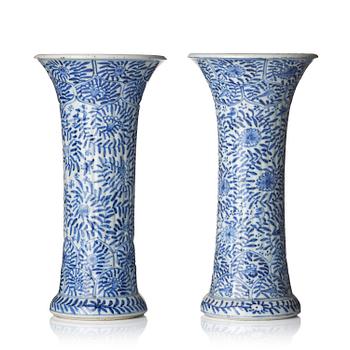 1162. A pair of blue and white 'floral' vases, Qing dynasty, Kangxi (1662-1722).