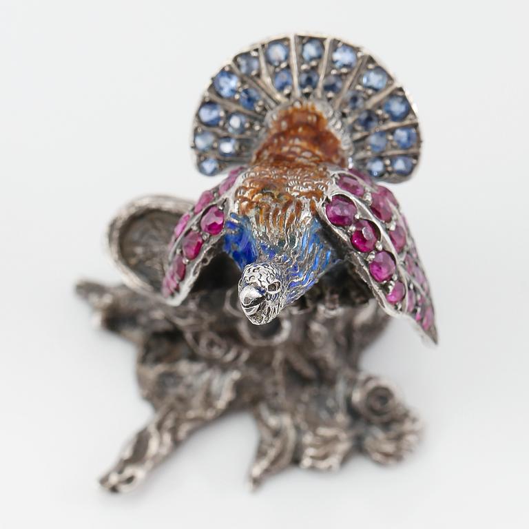 FIGUR, silver, emalj, rubiner och safirer, 1900-talets första hälft. Vikt ca 33 gram.