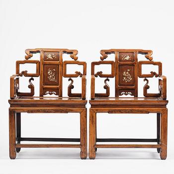 A pair of hardwood armchairs, late Qing dynasty.