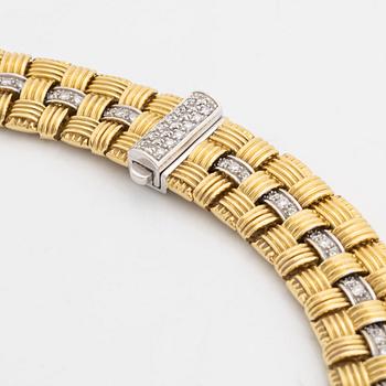An 18K gold necklace set with round brilliant-cut diamonds.