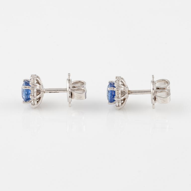 A pair of 14K gold earrings with faceted sapphires and eight-cut diamonds.