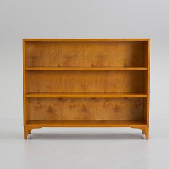 A mid 20th century birch veneered shelf.