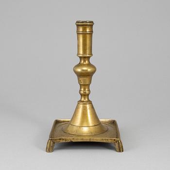 A 17th century bronze candlestick.