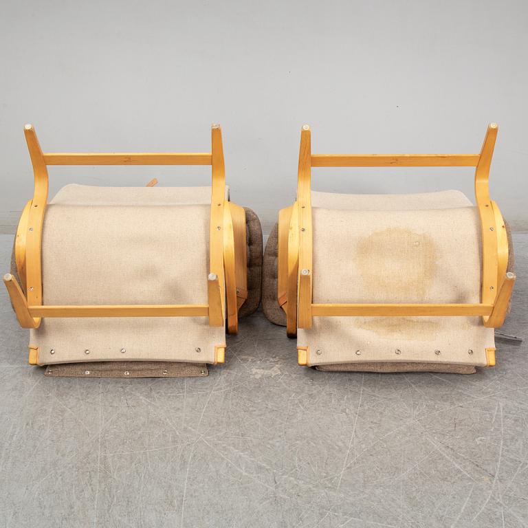 BRUNO MATHSSON, a pair of 'Pernilla' easy chairs, from Dux.