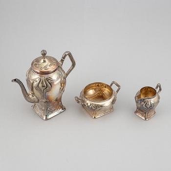 An art nouveau silver coffee pot, sugar bowl and creamer, mark of CF Källström, Malmö 1901.