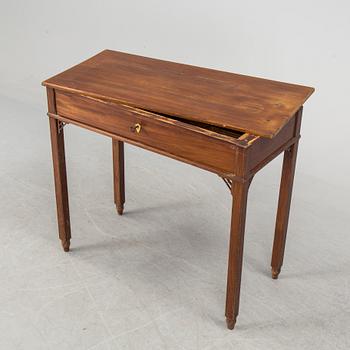 In the manner of the artist, a early 19th century late Gustavian table veneered with mahogany.