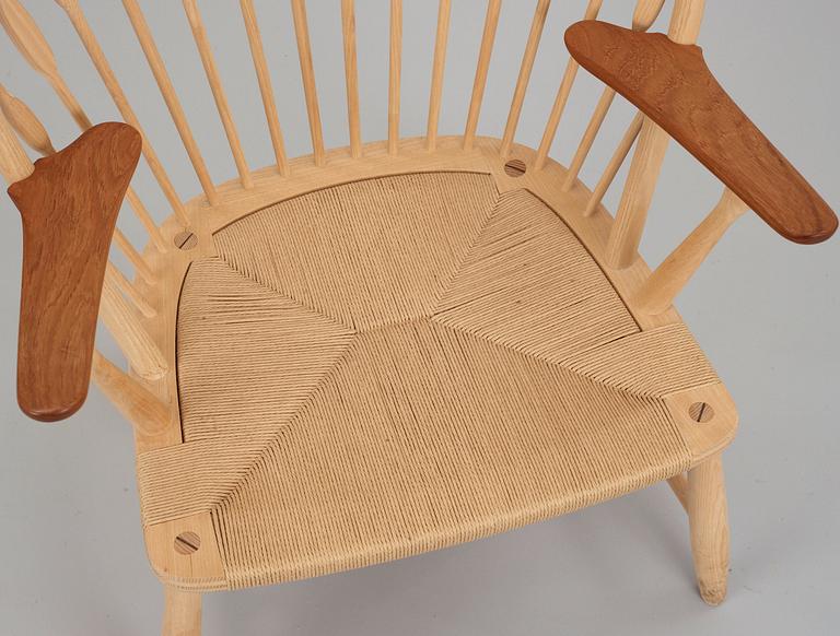 A Hans J Wegner ash and teak 'Peacock chair', by PP Møbler, Denmark.