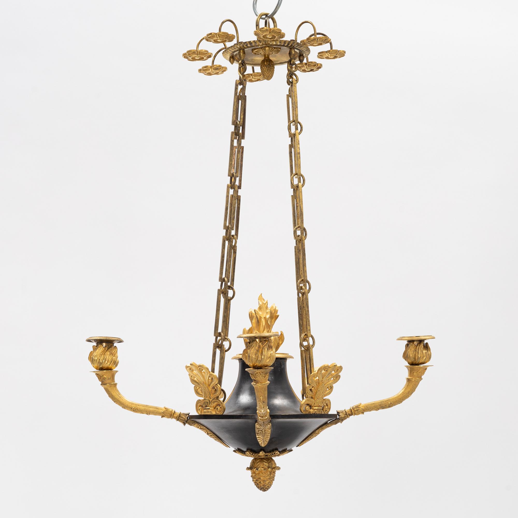 A French Empire ormolu and patinated bronze four-branch chandelier, early 19th century.