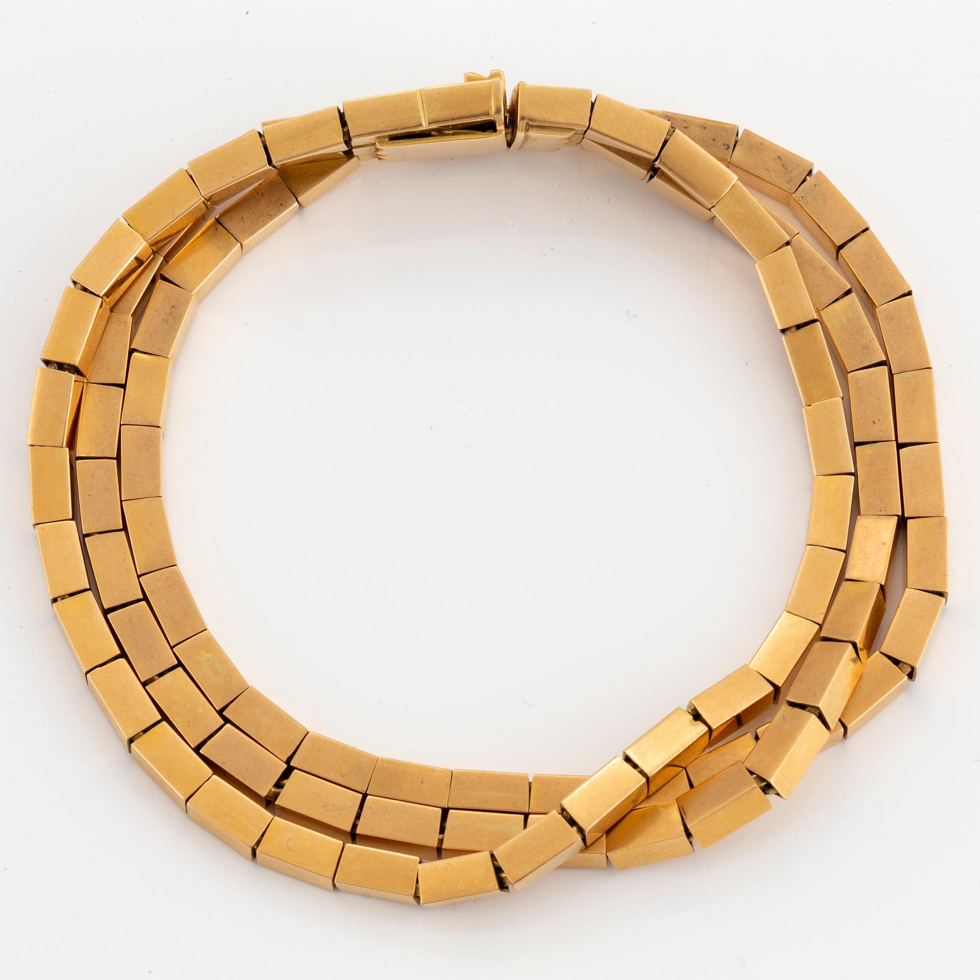 ARMBAND, treradigt 18K guld.