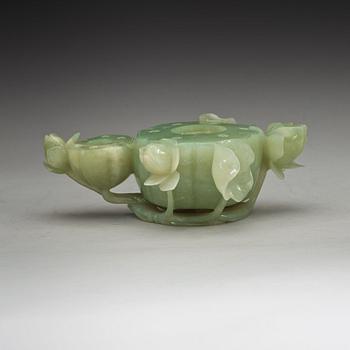 A Chinese lotusshaped serpentine stone brush washer.