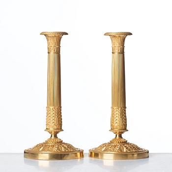 A pair French Empire candlesticks, early 19th century.