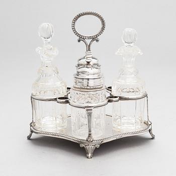Glass and sterling silver cruet stand, maker's marks of Samuel Hennell and Robert Hennell III, London 1811 and 1879.