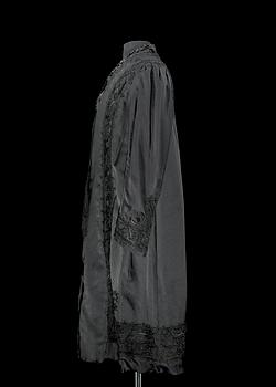 A late 19th cent black silk evening gown.