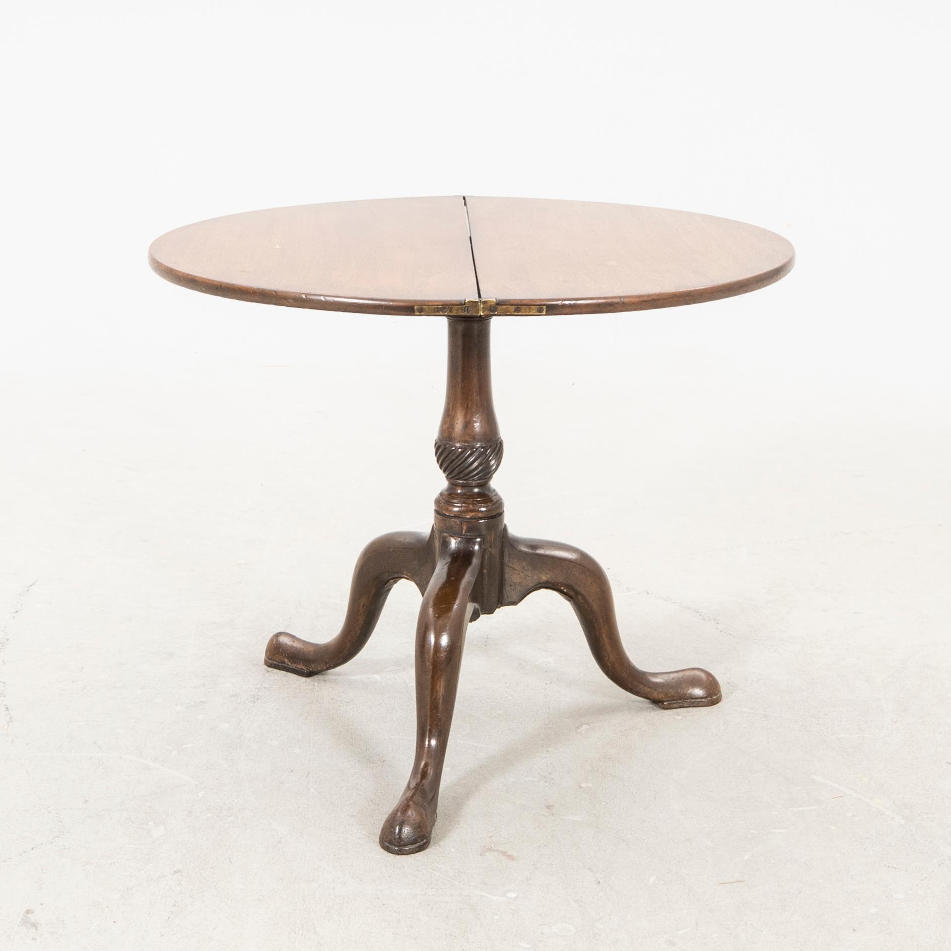 An English Queen Anne mahogany folding table 18th century.