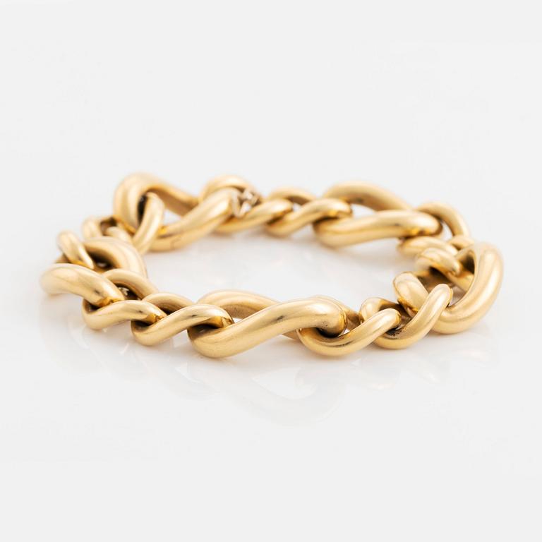 An 18K gold Tännler bracelet.