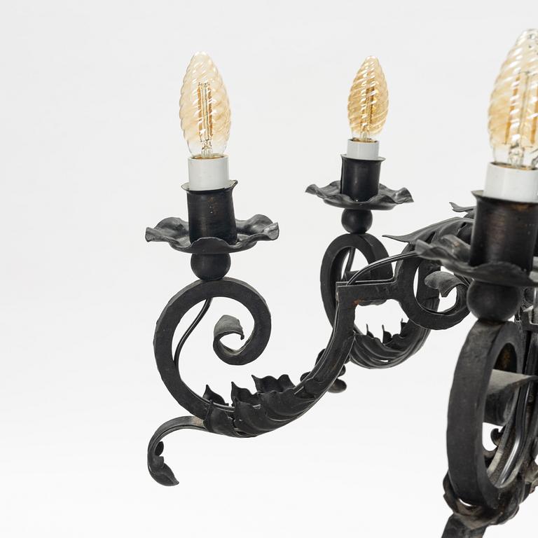 A black painted iron chandelier,