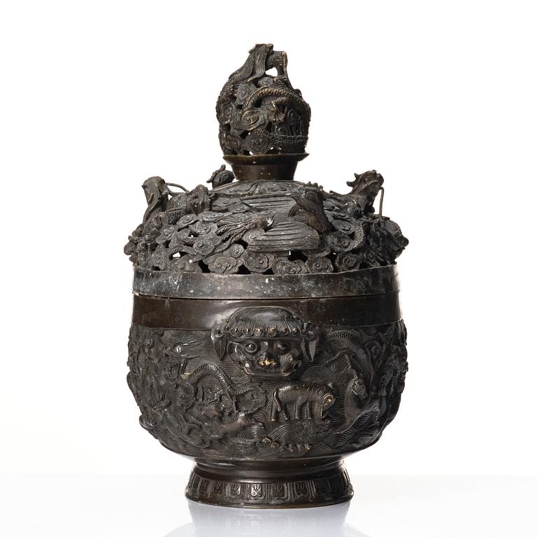 A bronze reticulated incense burner with cover, Qing dynasty (1644-1912).