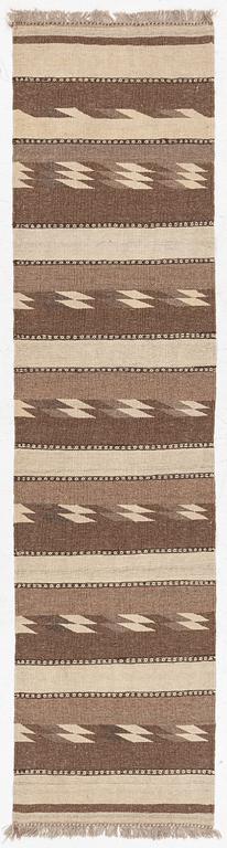 A Persian kilim runner, c. 248 x 62 cm.