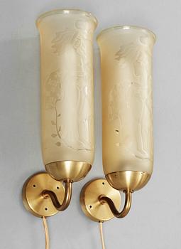 A pair of Bo Notini brass and yellow glass wall lamps, Glössner & Co, Stockholm 1940's-50's.