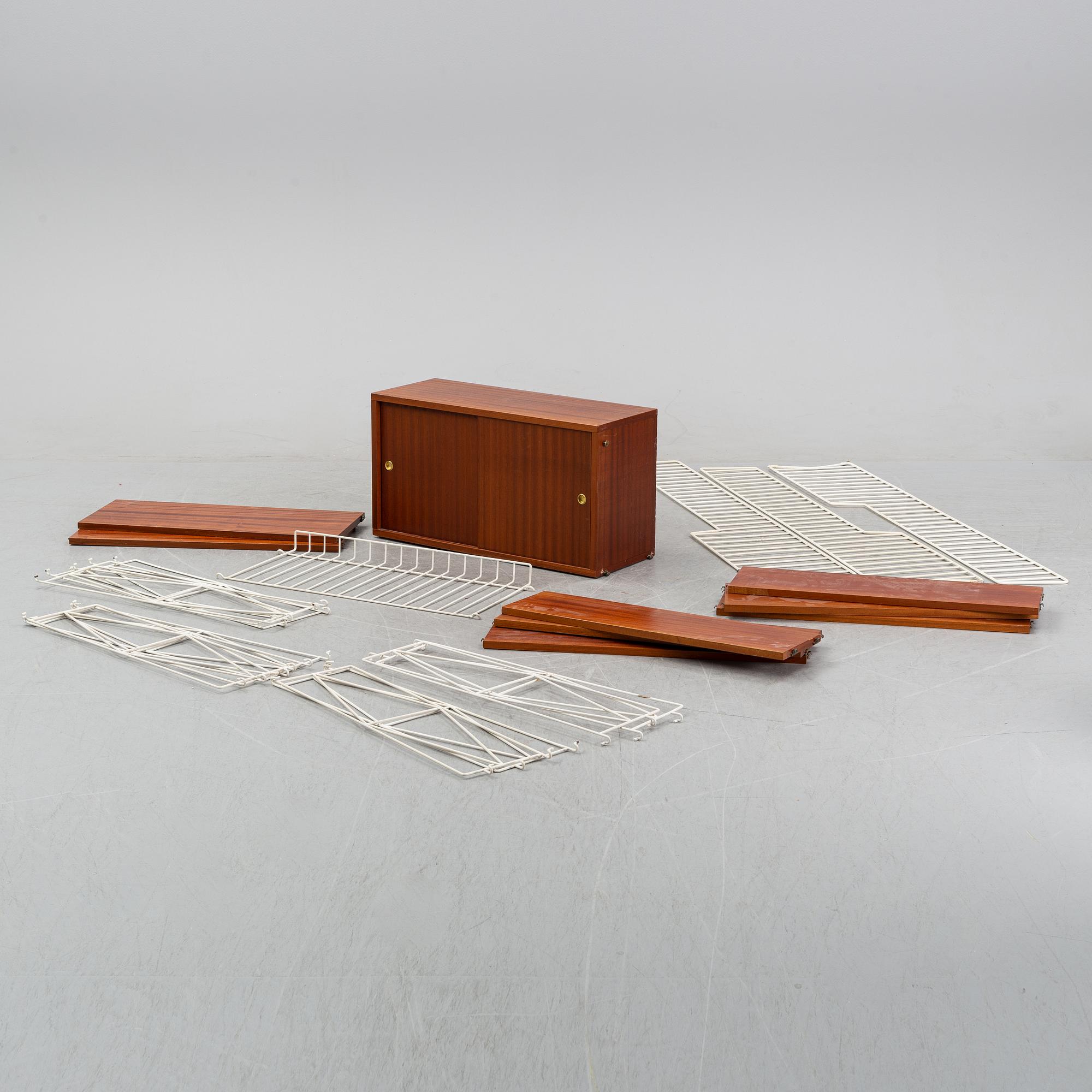 A 'String" bookcase, designed by  Nils Strinning,