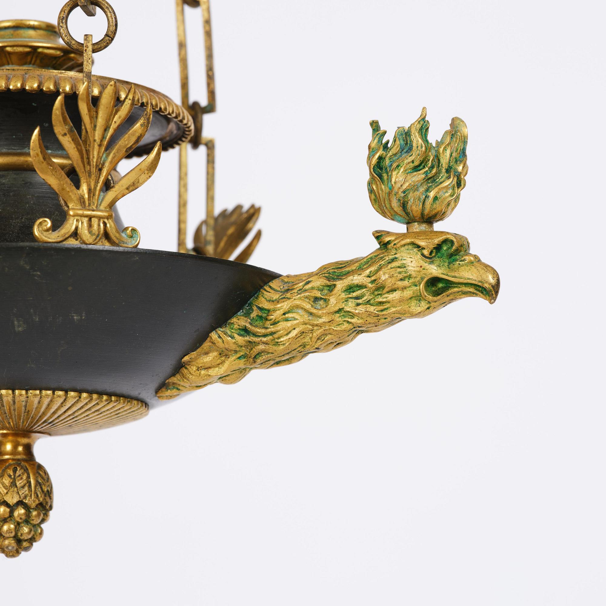An Empire ormolu and patinated bronze four-light chandelier, Stockholm, early 19th century.