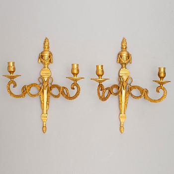 A pair of wall sconces, Louis XVI style, early 20th century.