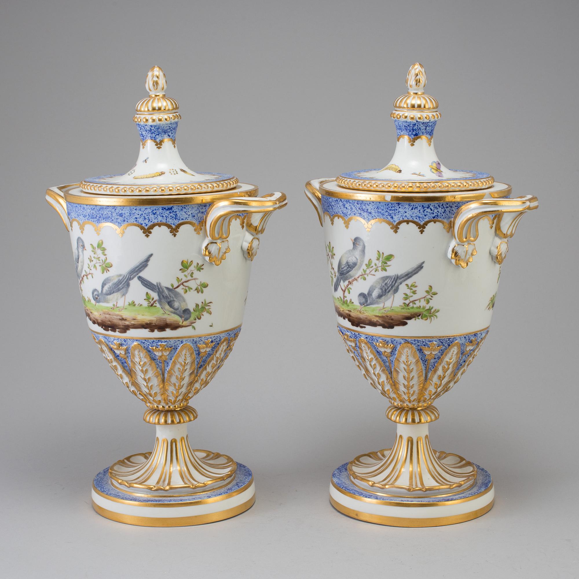 A pair of French 19th century porcelaine 
lidded vases with Sèvres style mark.