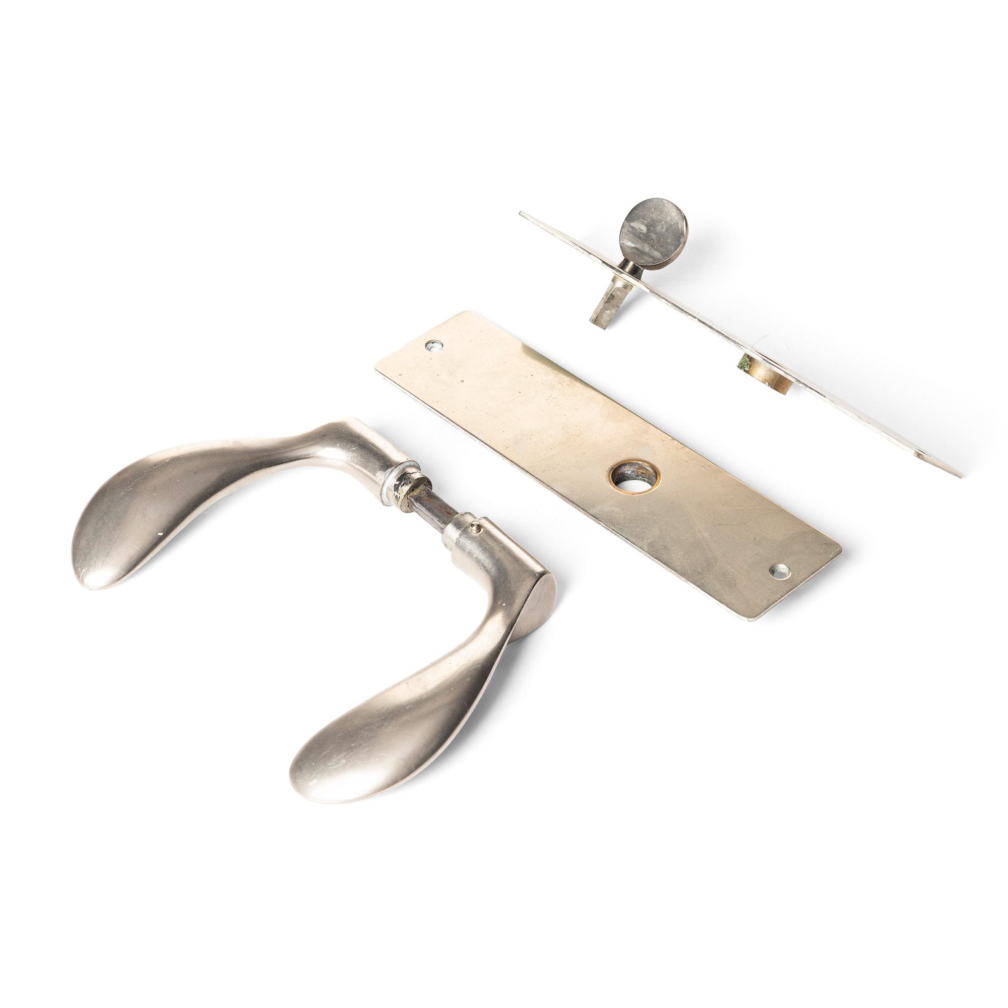 Arne Jacobsen, a door handle 'AJ-Grebet' for SAS Royal Hotel, Copenhagen 1956, executed by Carl F Petersen.