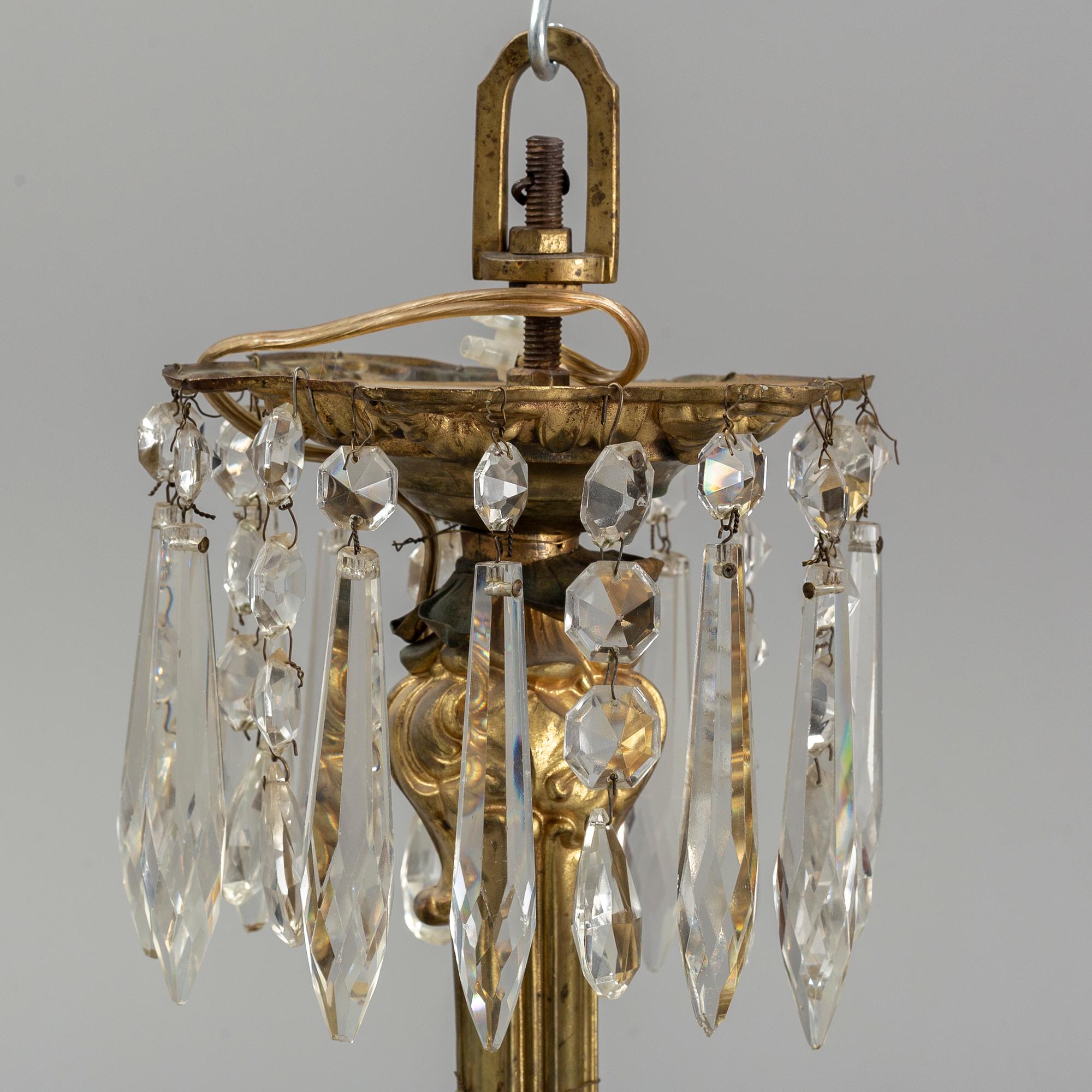 A late 19th century brass ceiling light.