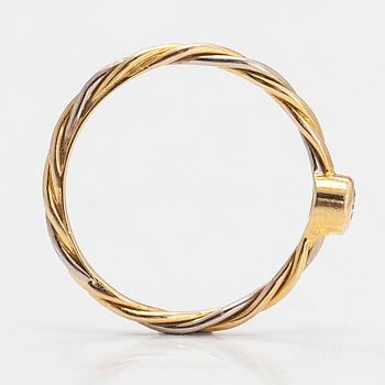 Cartier, an 18K gold ring with a diamond ca 0.06 ct.