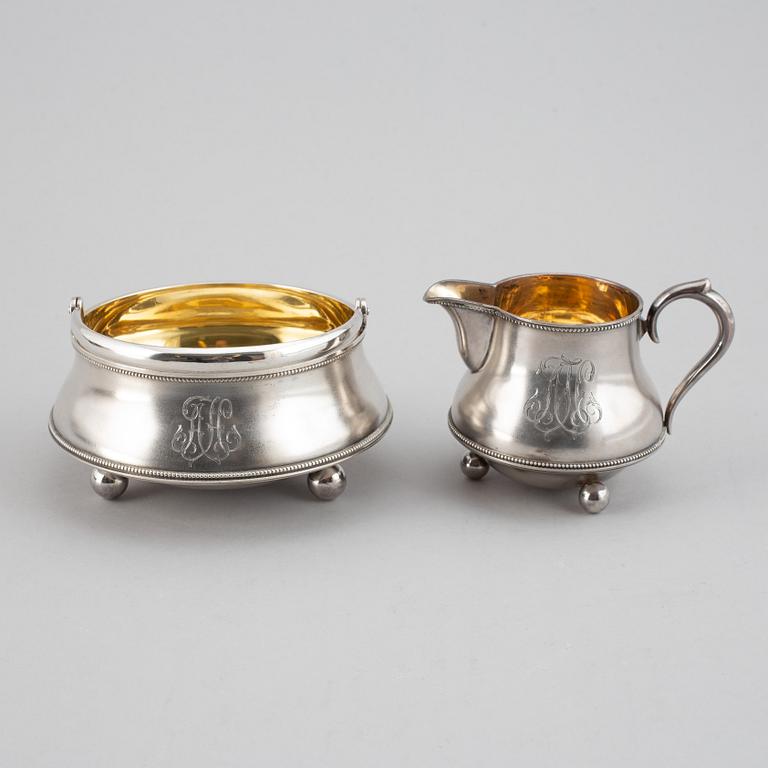 A parcel-gilt silver creamer and bowl, St Petersburg 1898-1903.