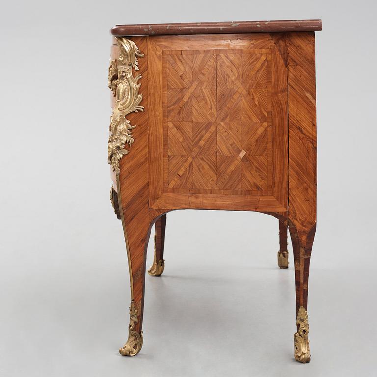 A Louis XV kingwood parquetry and ormolu-mounted commode in the manner of Jacques-Philippe Carel (Paris, 1723-1760).