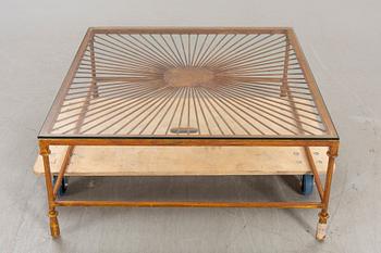 A late 20th century metall and glass coffee table.