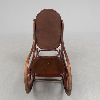 A stained rocking chair by Thonet, about 1900.
