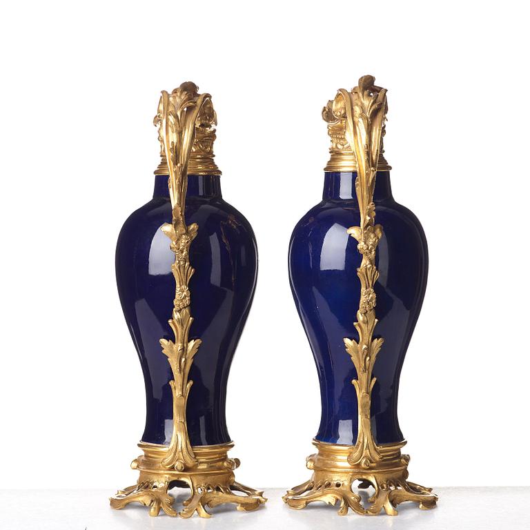 A pair of gilt bronze mounted vases, Qing dynasty, Qianlong (1736-95). French bronze mounts.