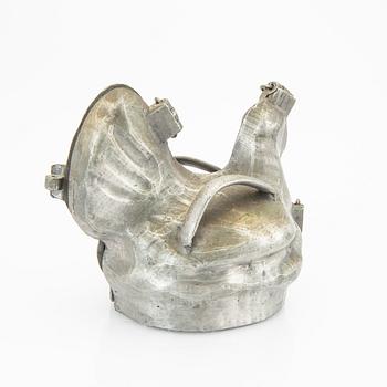 A set of four pewter icecream moulds around 1900.