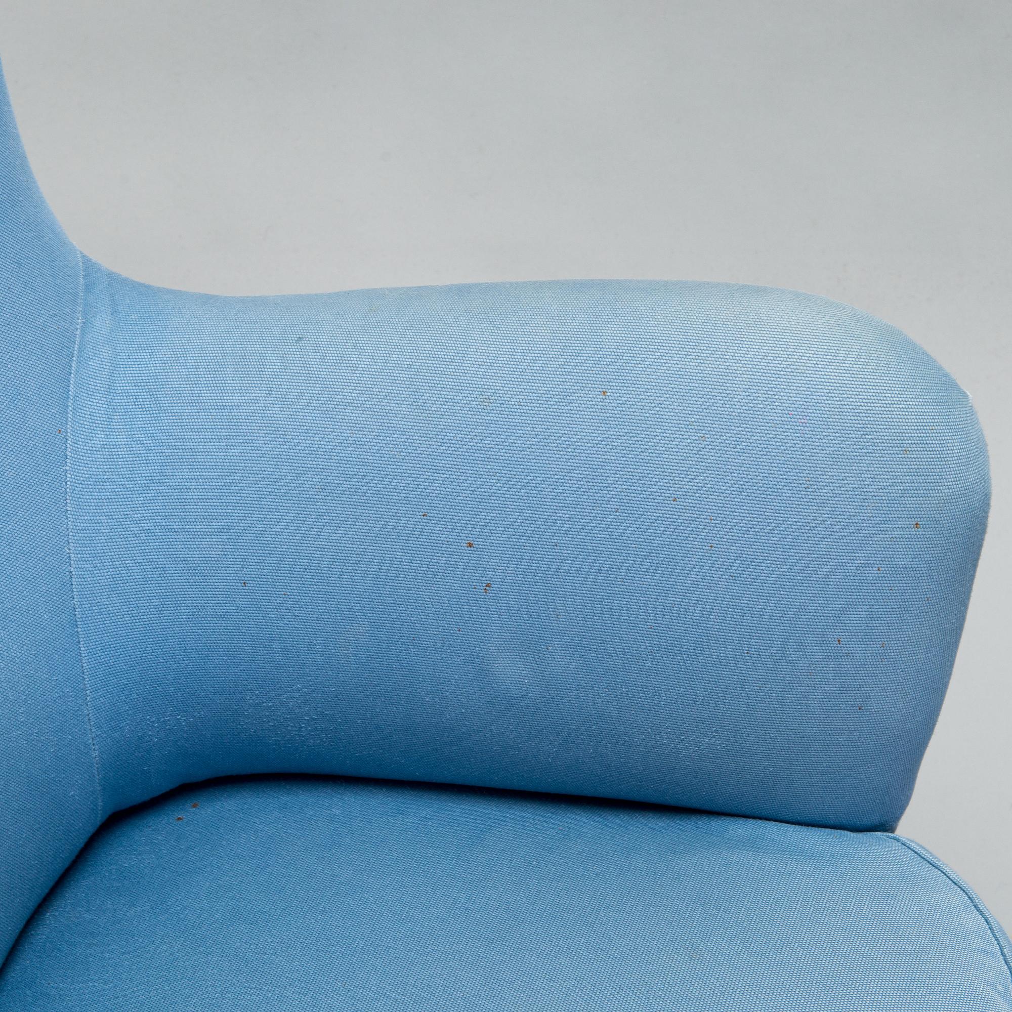 A pair of mid-20th-century armchairs.