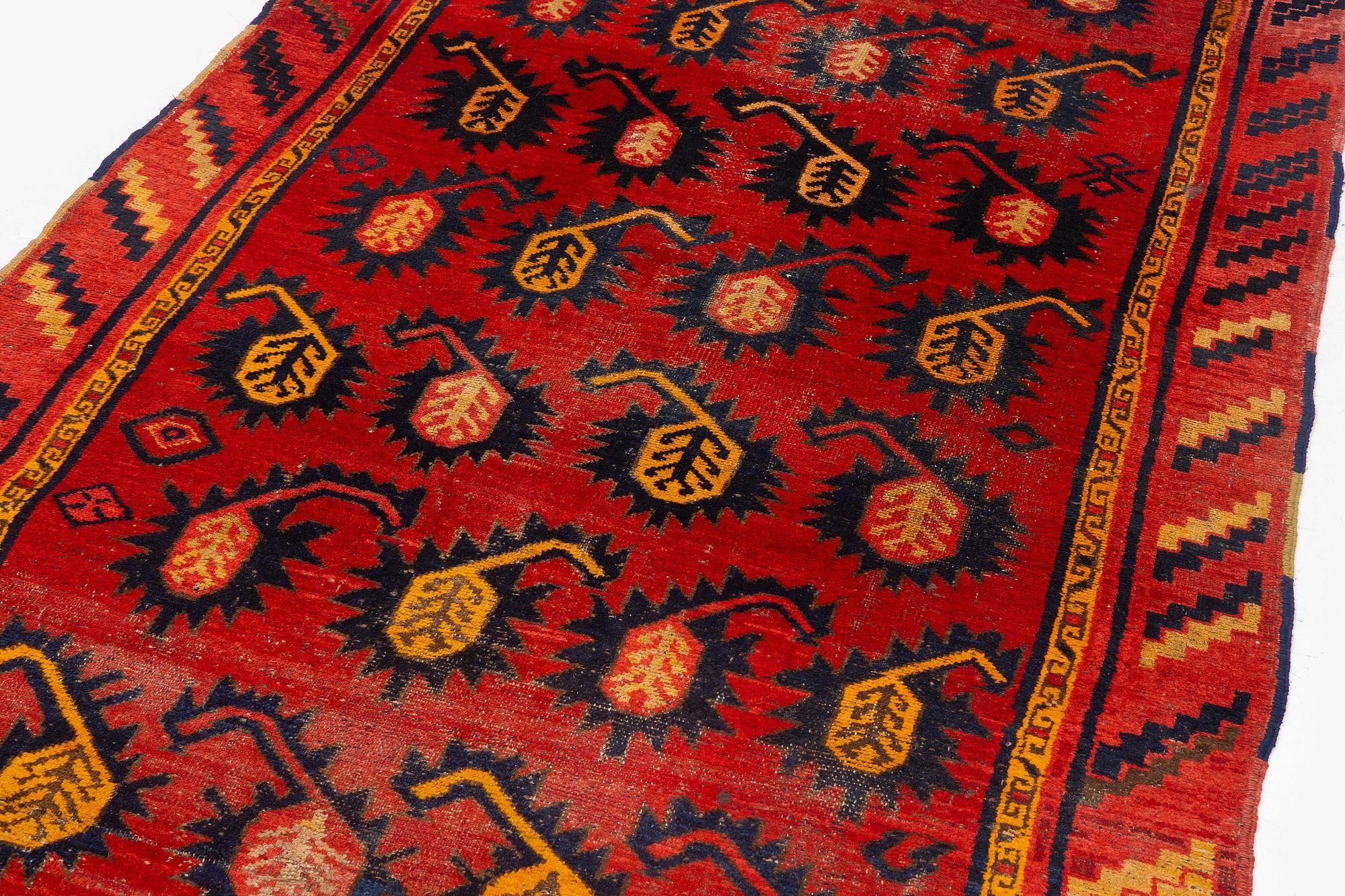 An antique Central Asian carpet, possibly Kirghiz, c. 346 x 154 cm.